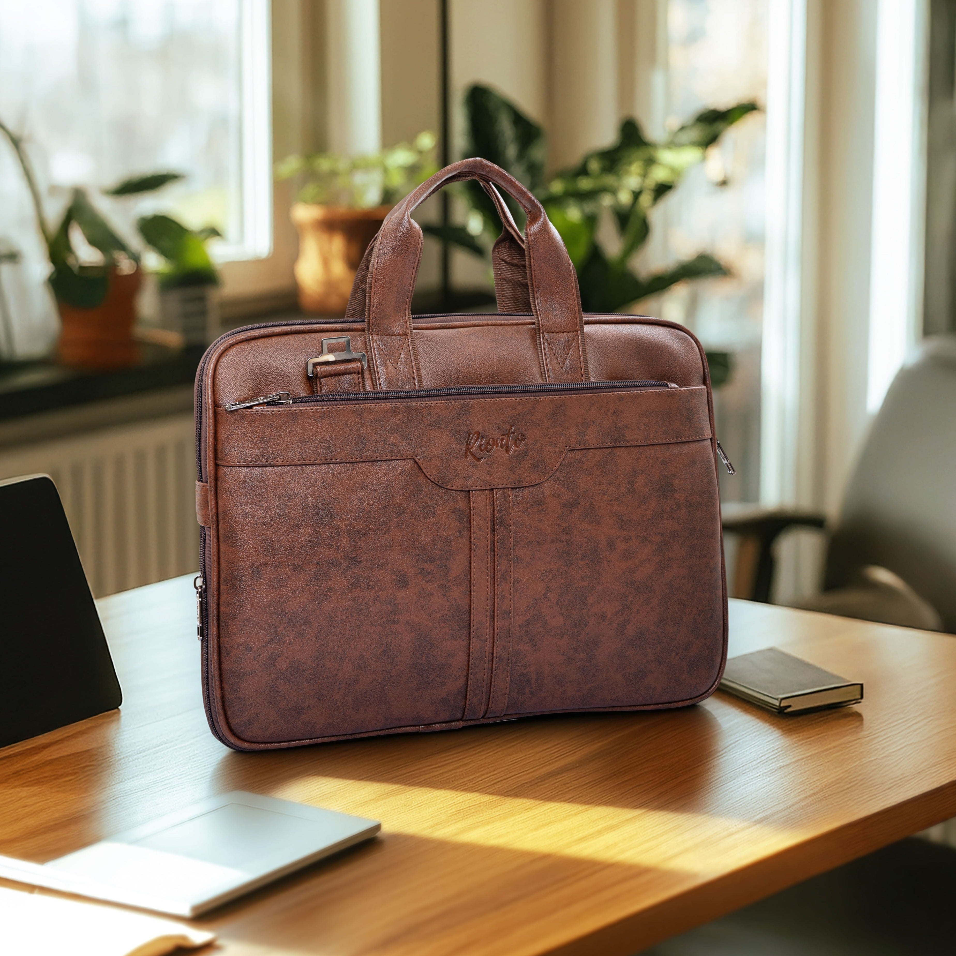 Brown leather briefcase on a wooden desk with a blurred indoor background