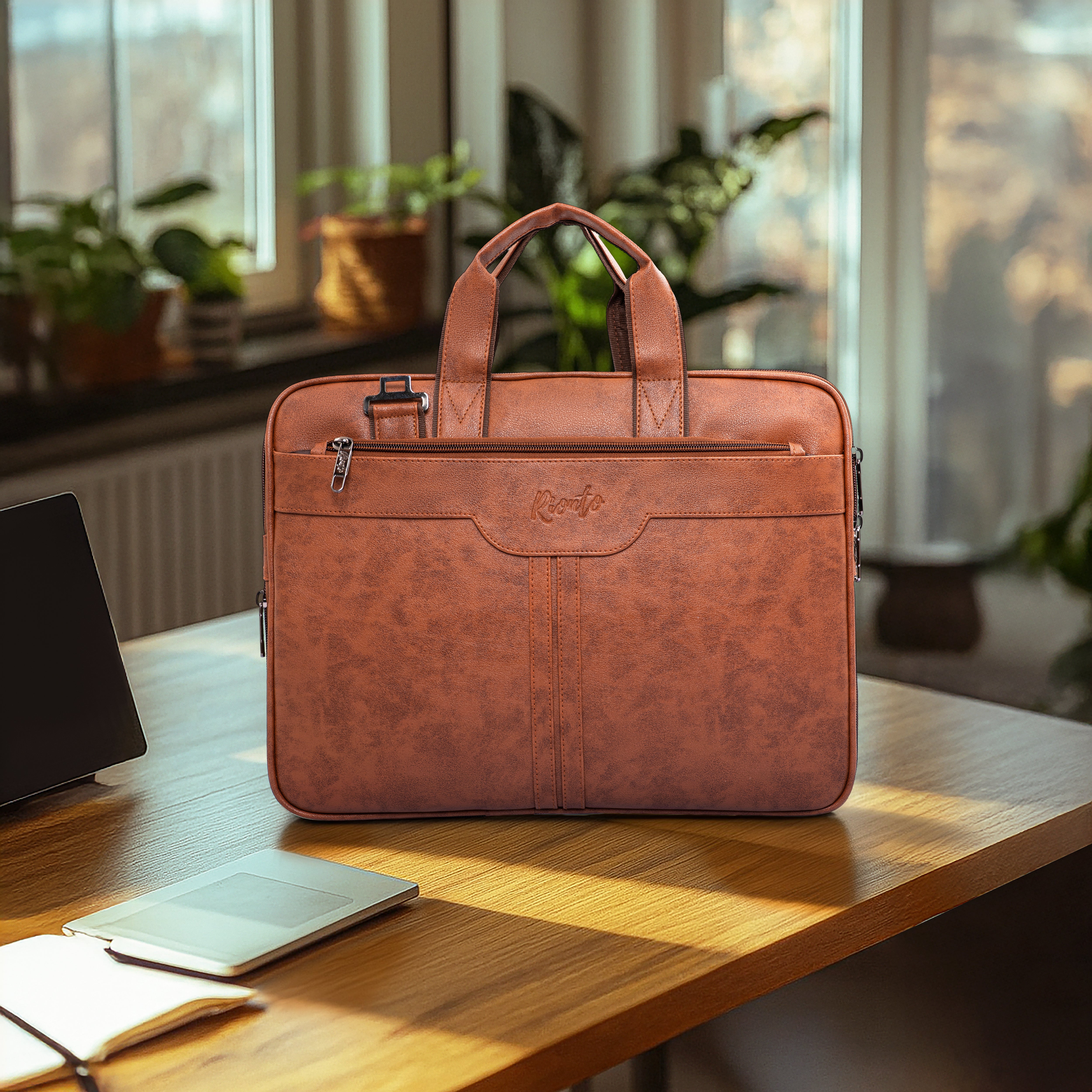 Brown leather briefcase on a wooden desk with a blurred indoor background